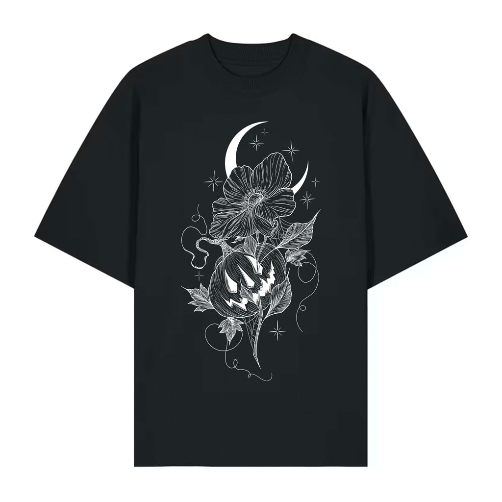Black organic cotton T‑shirt with a blackwork tattoo‑style design featuring a crescent moon, flowers, stars, and a carved pumpkin illustration.