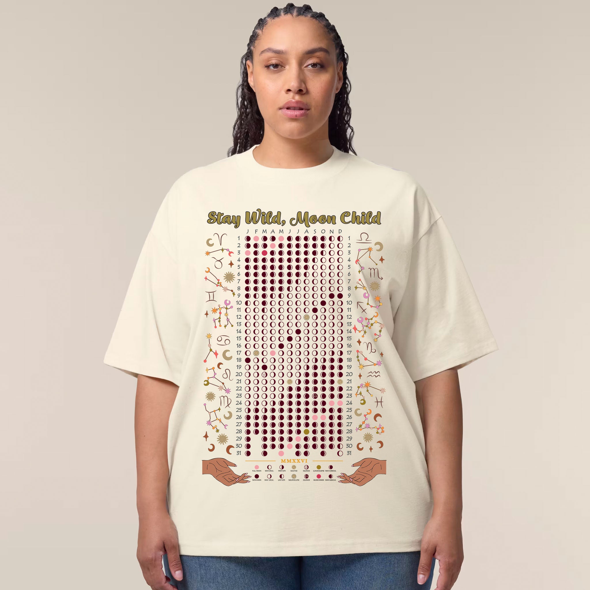 Person wearing a cream t-shirt with text and symbols on a plain background