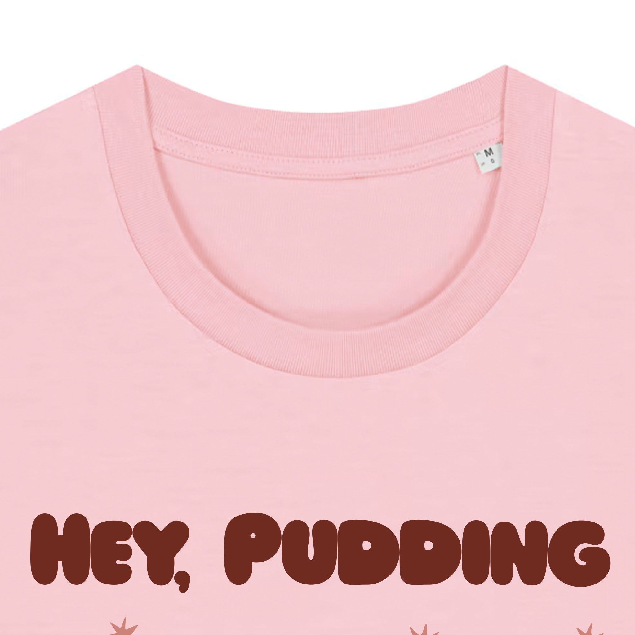 Pink t-shirt with 'Hey, Pudding' text on a white background