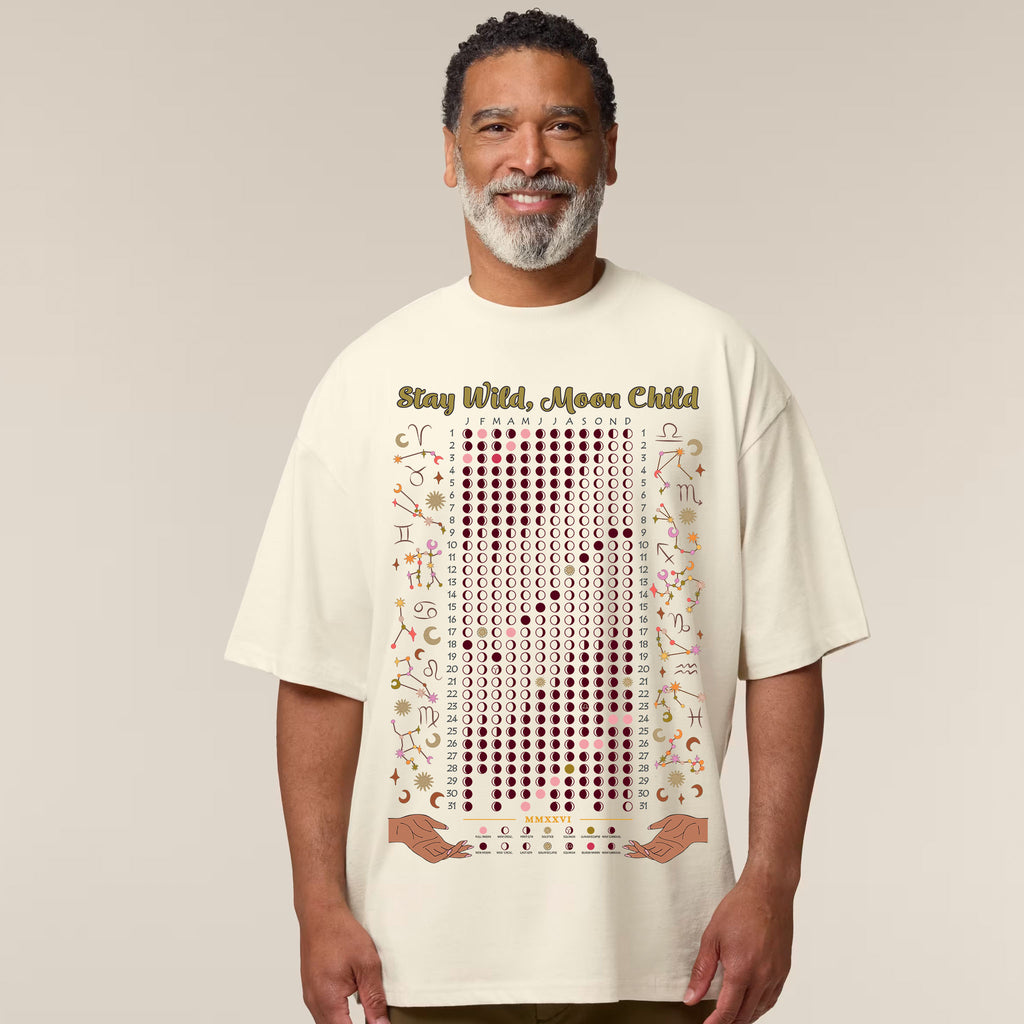 Man wearing a t-shirt with text and graphics on a plain background