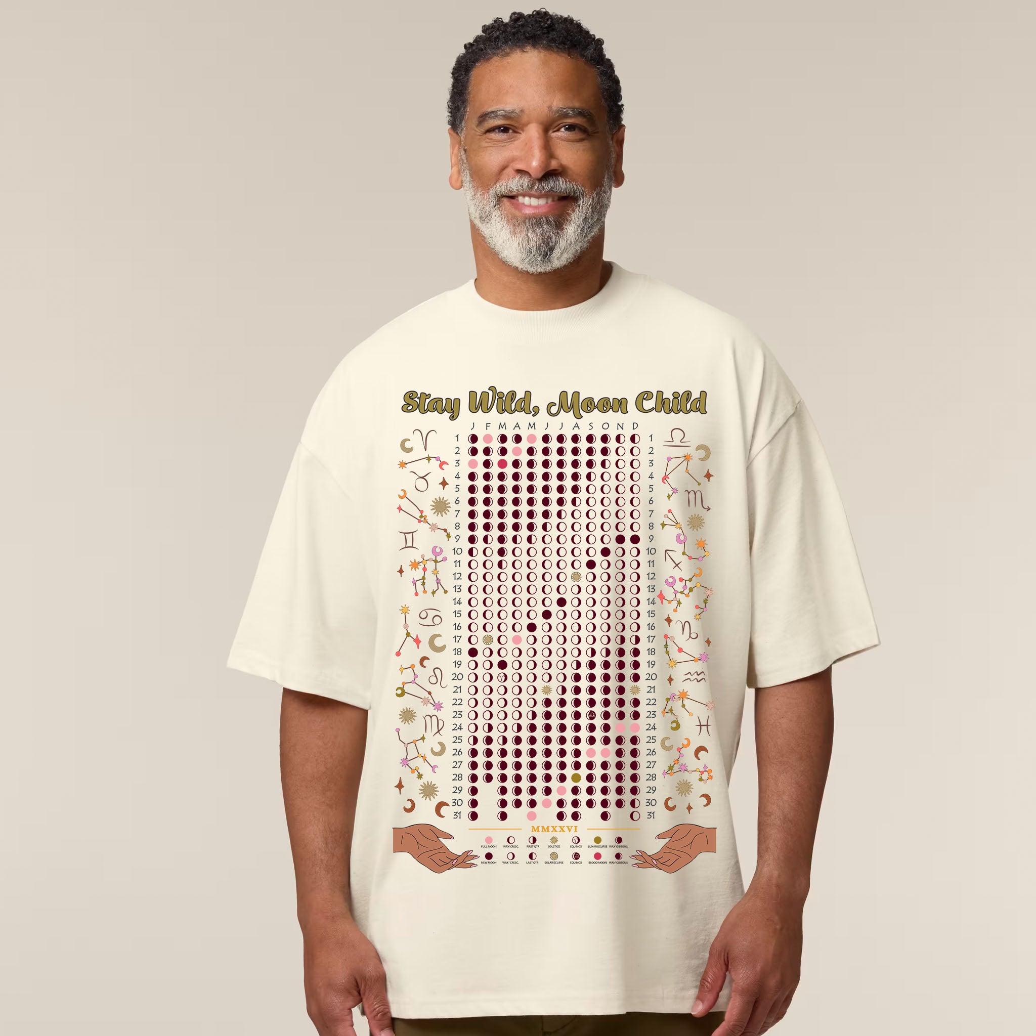 Man wearing a t-shirt with text and graphics on a plain background