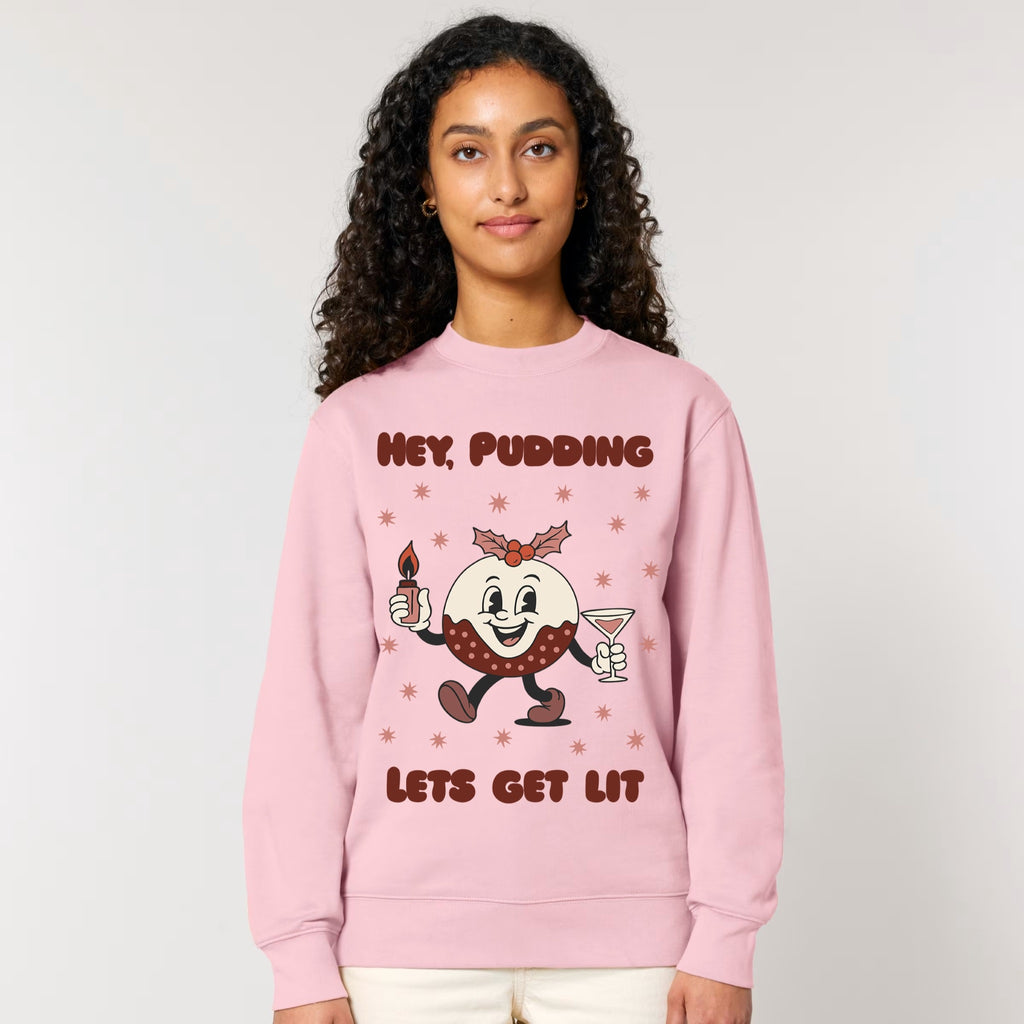 Person wearing a pink sweatshirt with a cartoon character and text on a plain background
