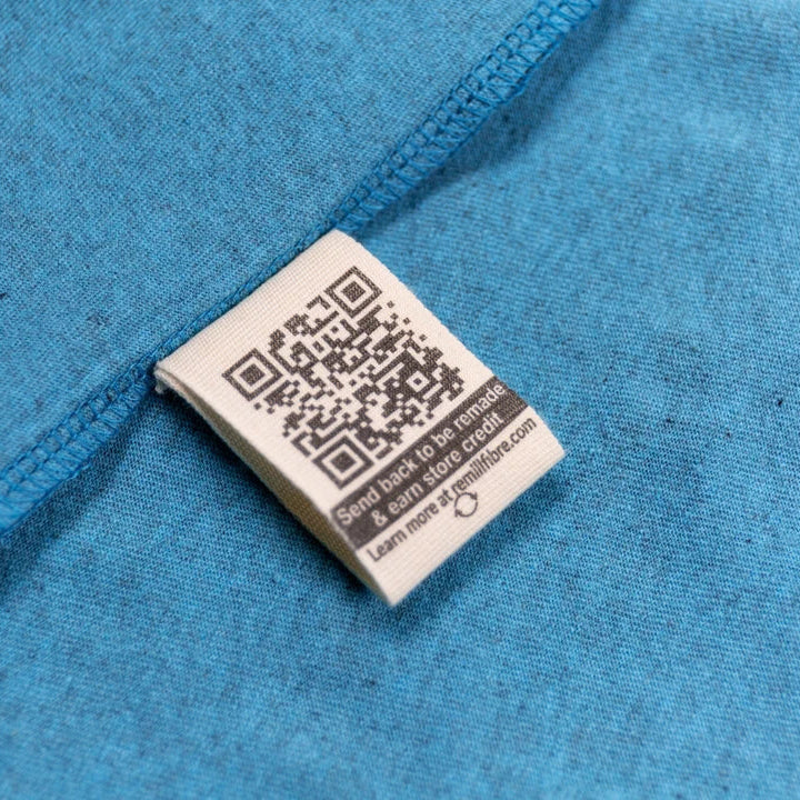Close-up of a QR code label on blue fabric